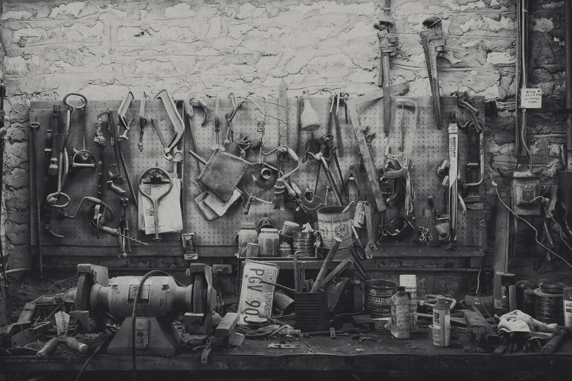 Dusty ranch tools and rustic workbench